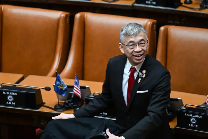 Assemblyman Lester Chang, R-Brooklyn, arrives in the Assembly Chamber on the opening day of the 2023 legislative session at the state Capitol, in Albany. On Friday, Assembly Speaker Carl Heastie said Chang can remain in the Assembly.
